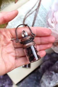 flower bottle necklace with hibiscus petals and clear quartz